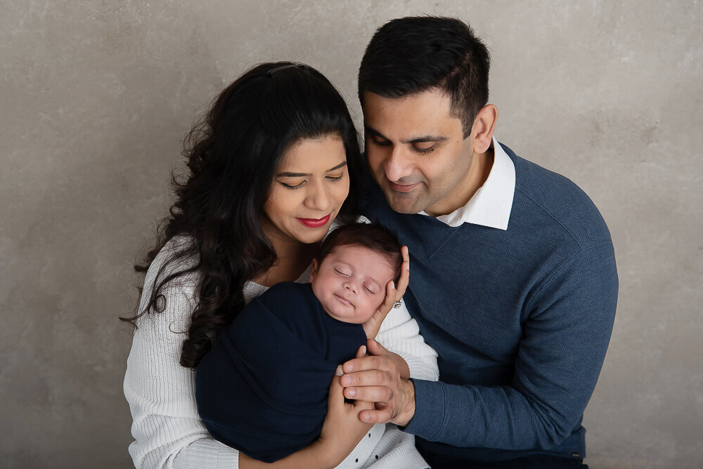 Mom and dad holding baby boy