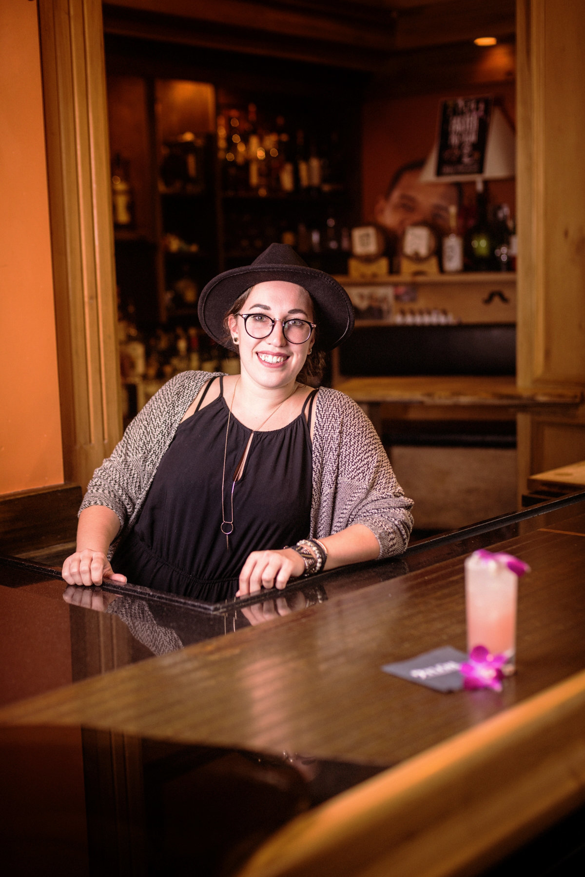 Advertising portrait photograph of a bartender in a hip bar
