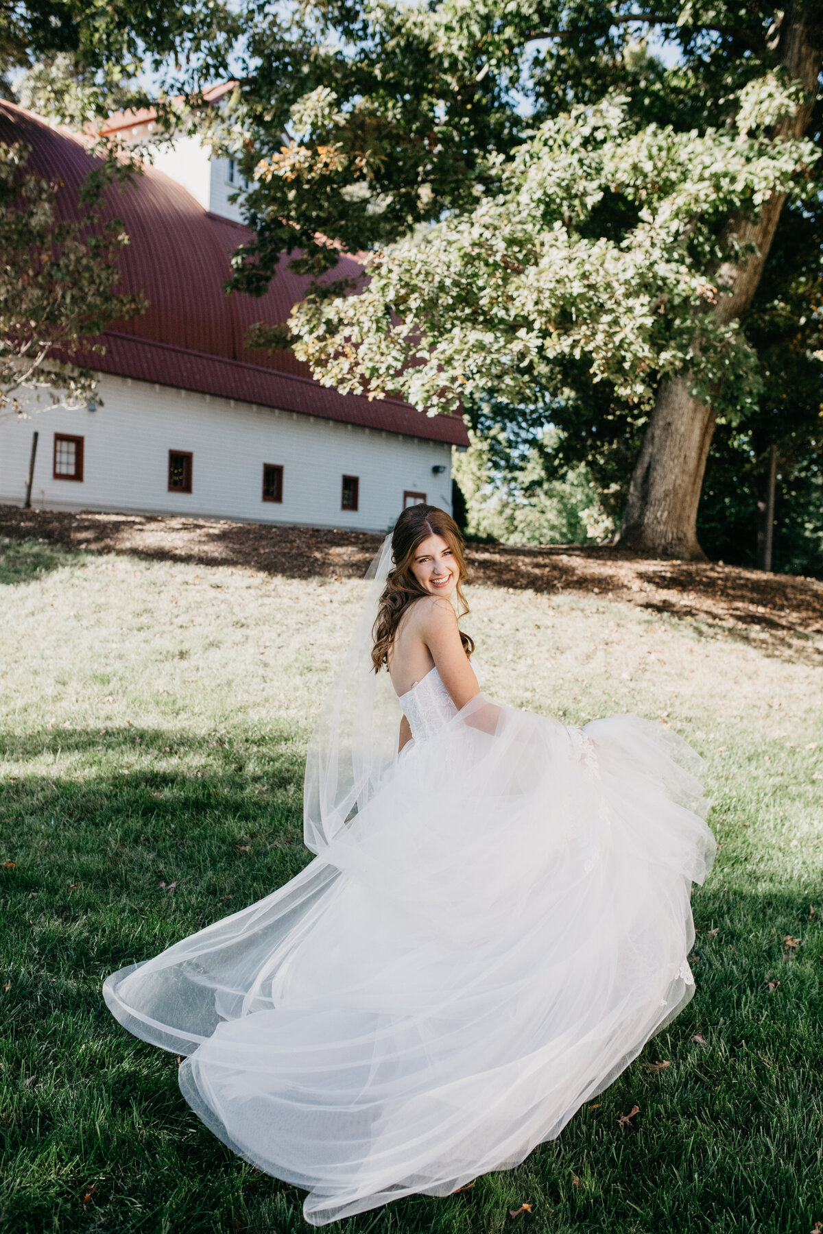 bride twirling in wedding gown bridal portrait