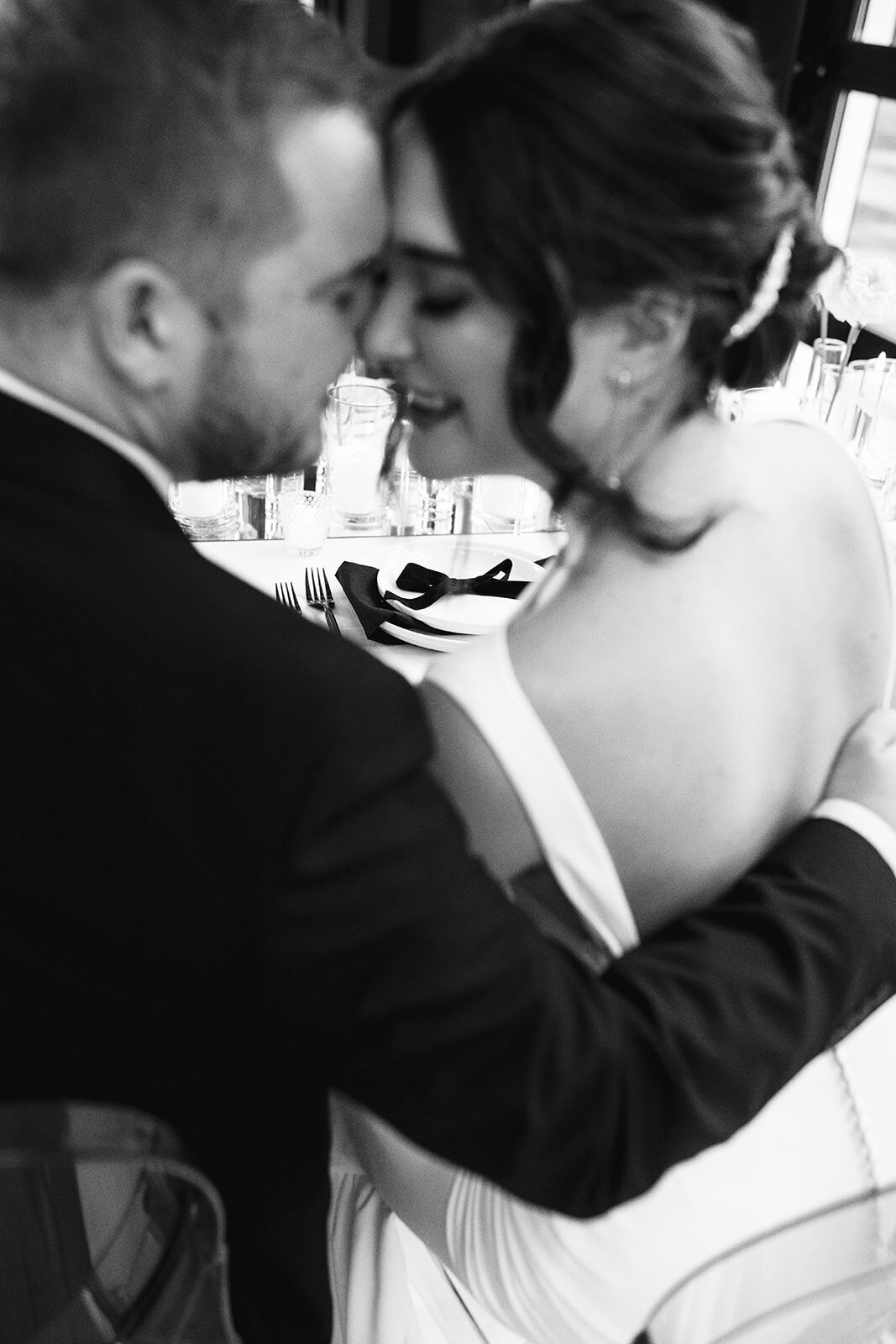 A bride and groom lean into each other during a styled wedding photography shoot.