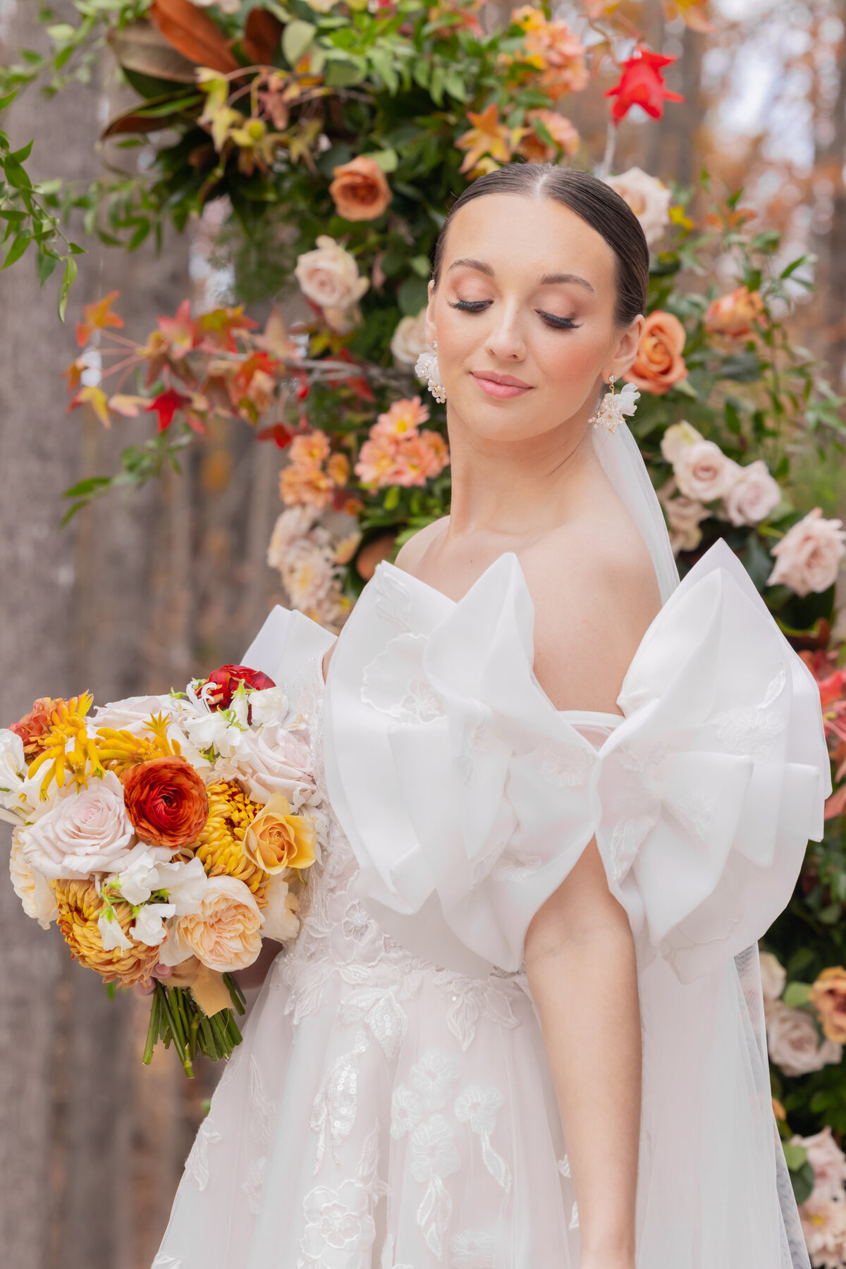 Bride wearing white dress and bow sleeves in Orlando Florida by wedding photographer Amanda Richardson Photography