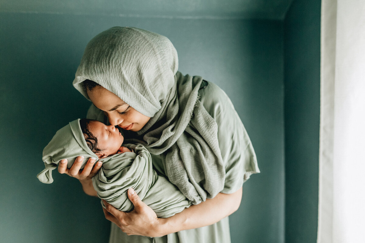 Mom holding new born baby.