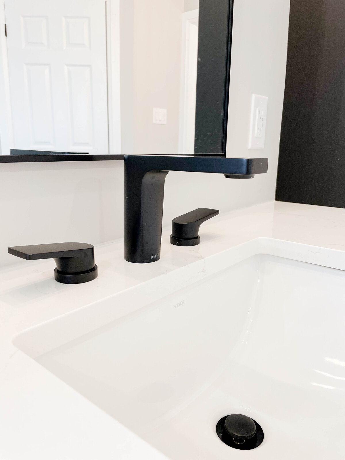 widespread-faucet-black-bathroom