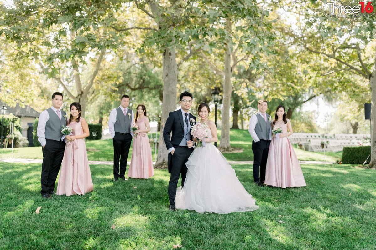 Bridal party pair off with their partner and pose for photos