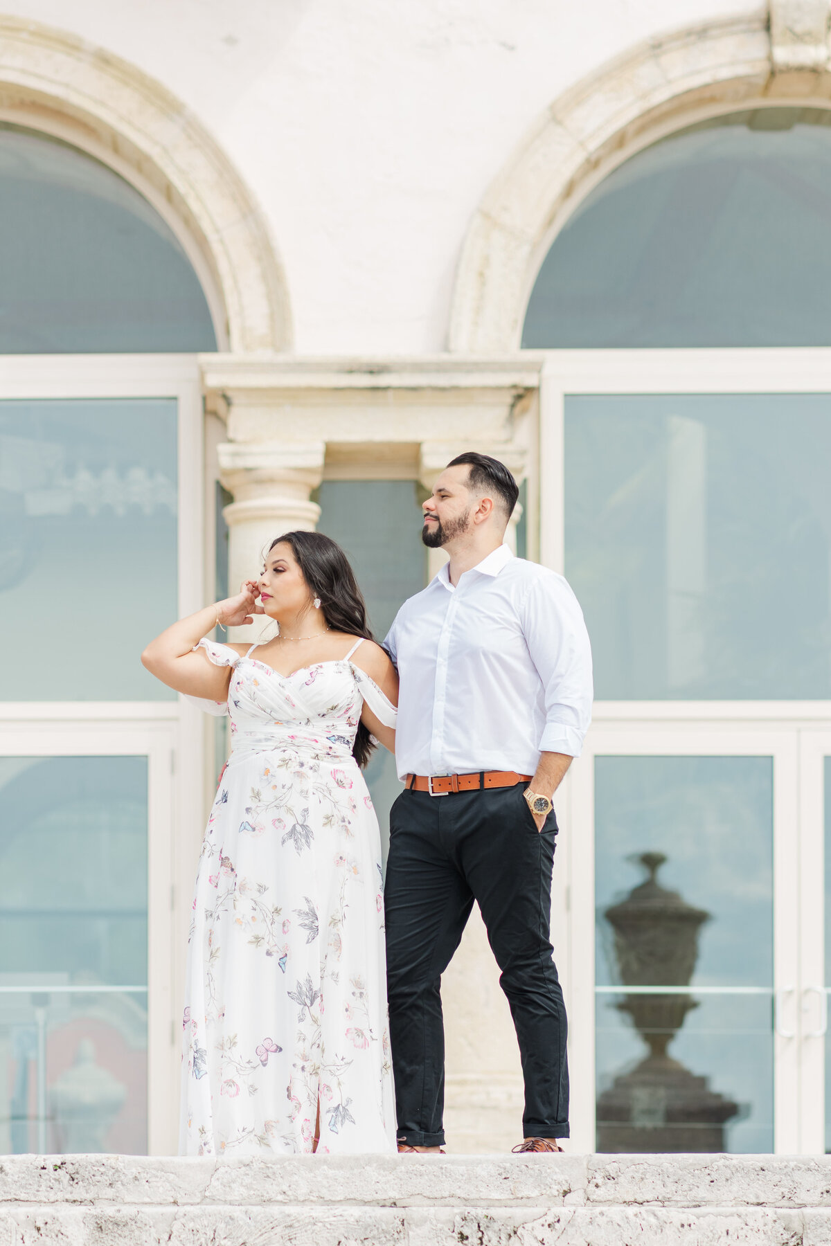 a cuple standing at the vizcaya museum of  miami