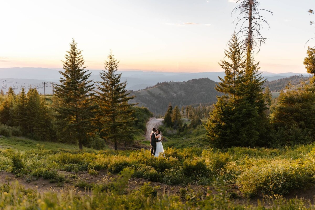A wide shot of a couple on an Idaho Mountain during their elopement