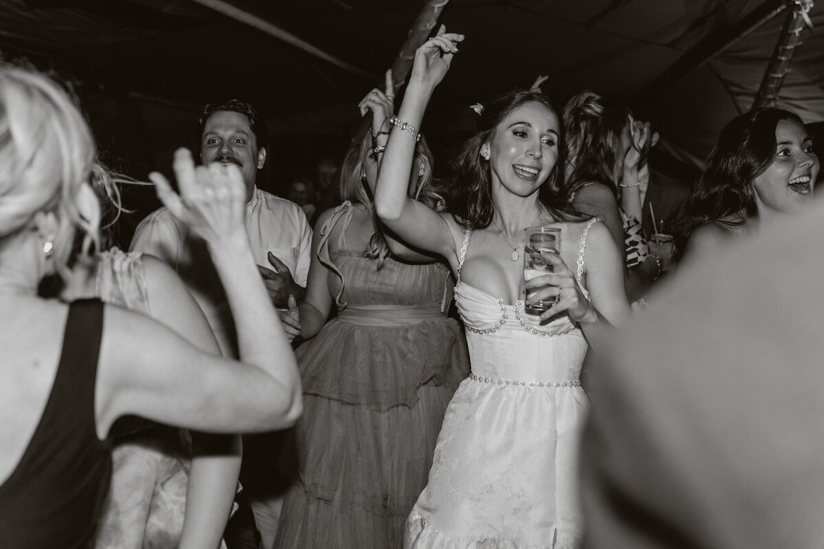 Mum and dad dancing on the dancefloor at their daughters wedding in Tenby
