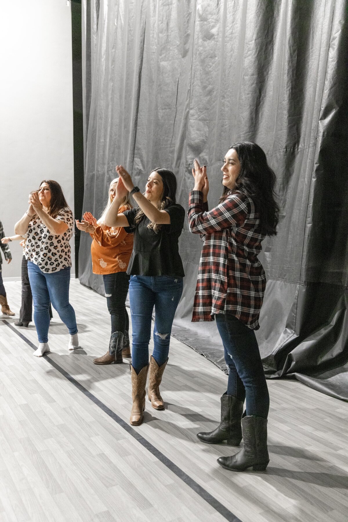 group of women on sidlein cheering on a group