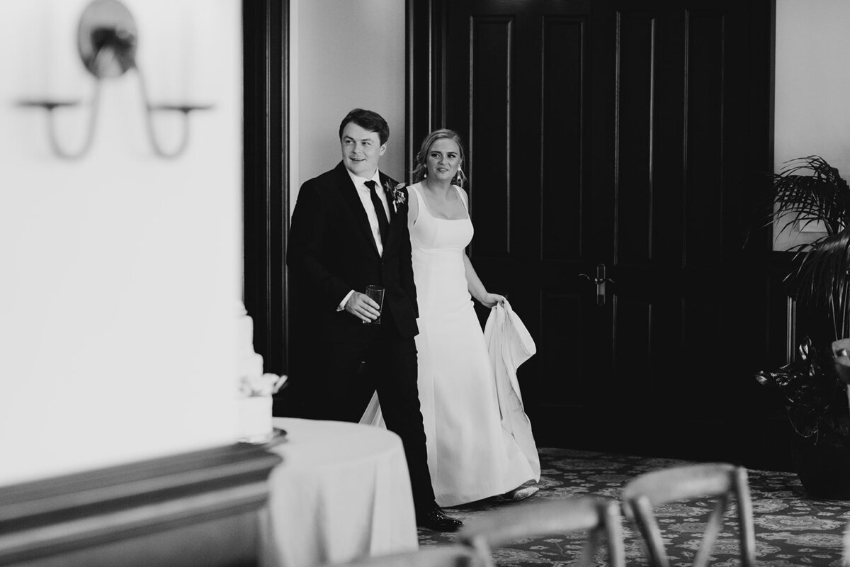 bride and groom see reception space