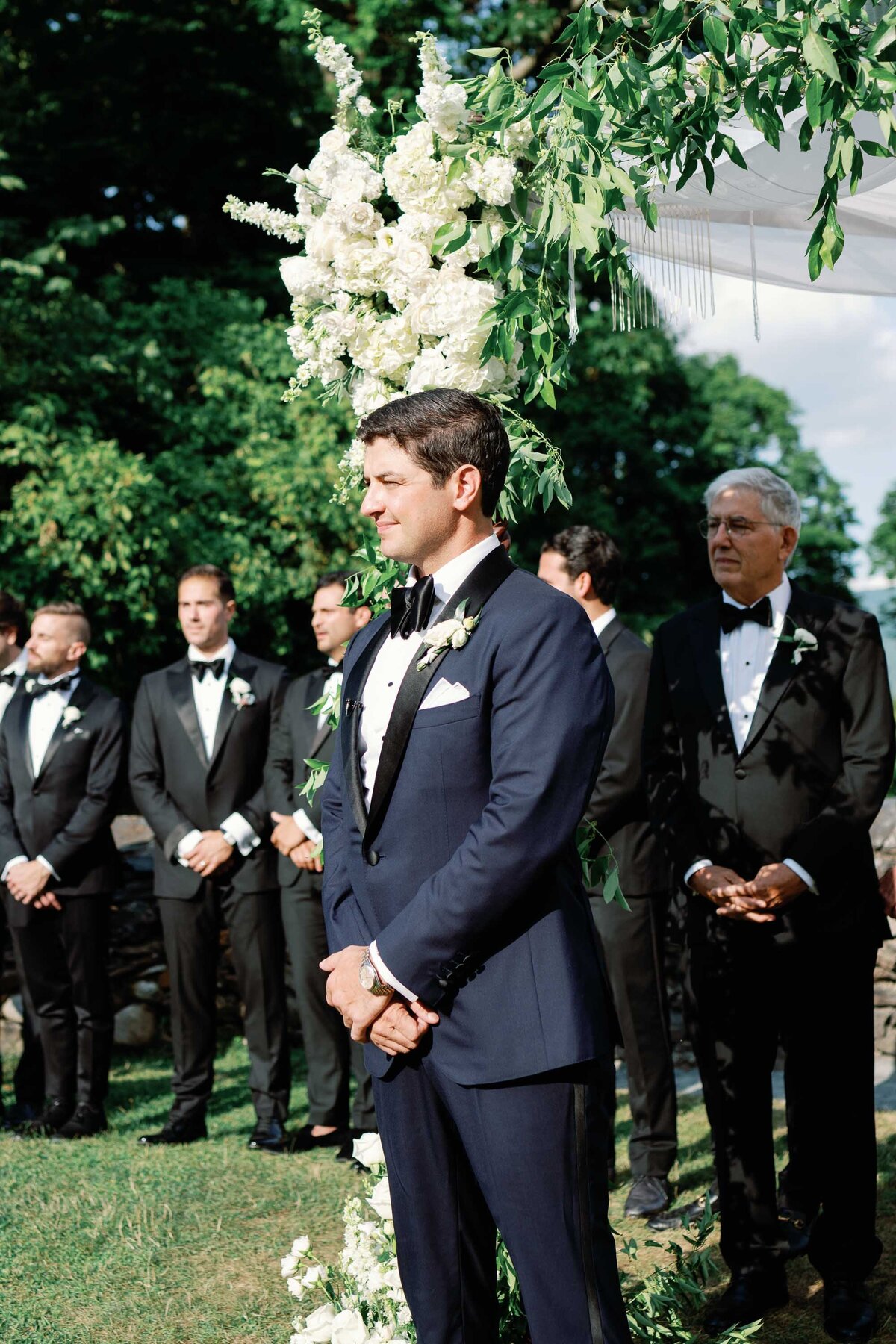 groom looks at bride at hildene wedding in manchster, vt ceremony