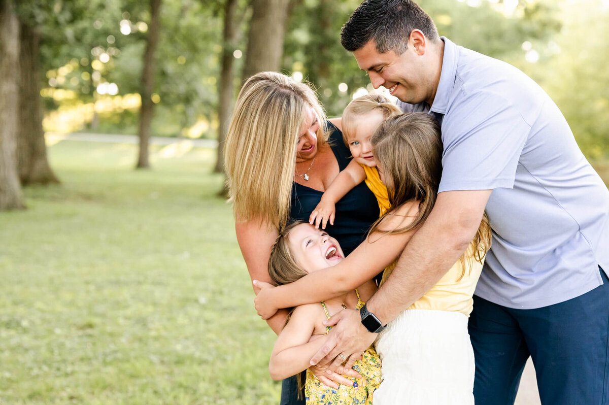 Family embracing at a summer family session near Naperville, IL