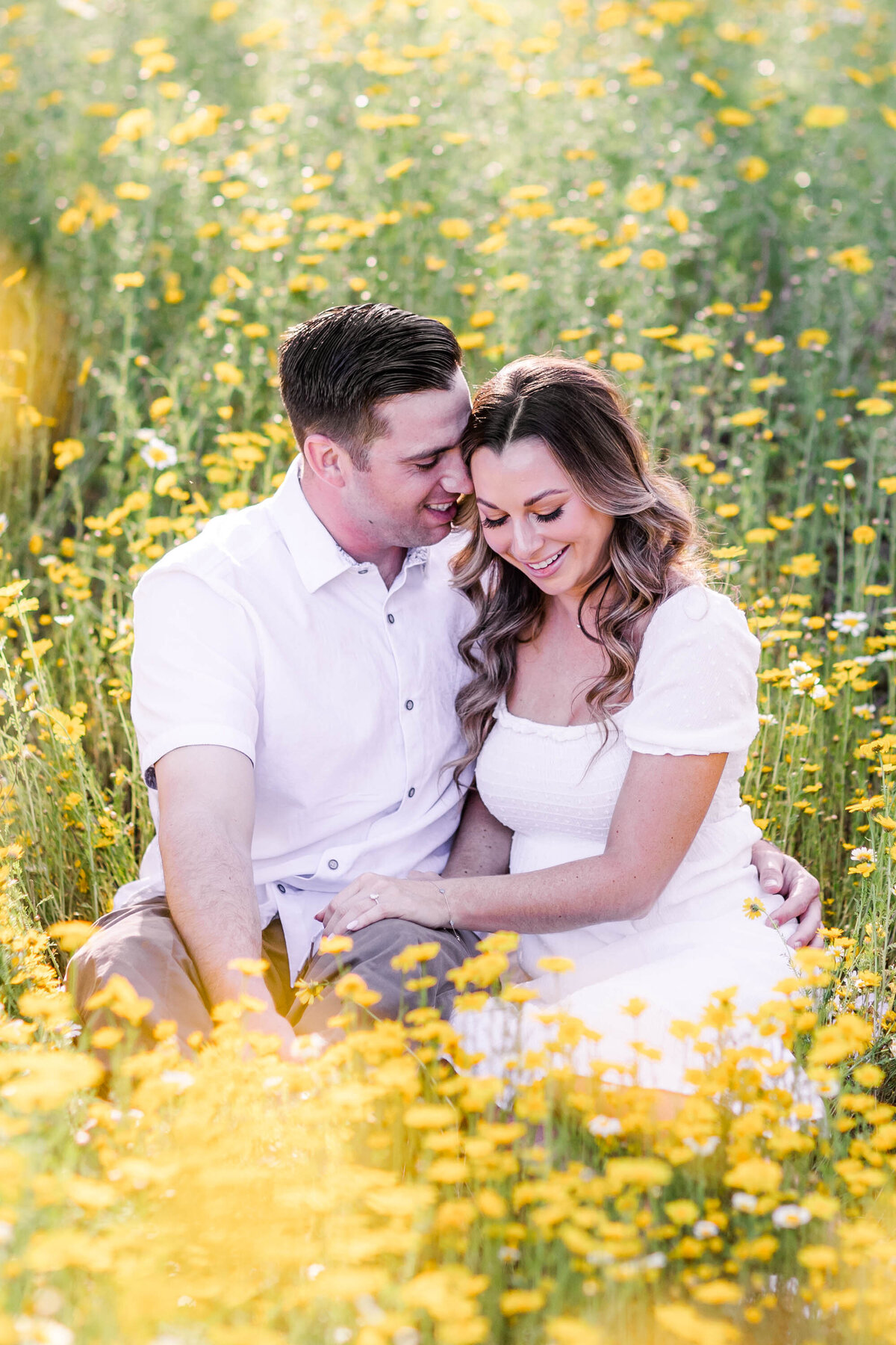 engagement-session-couple-in-yellow-flowers