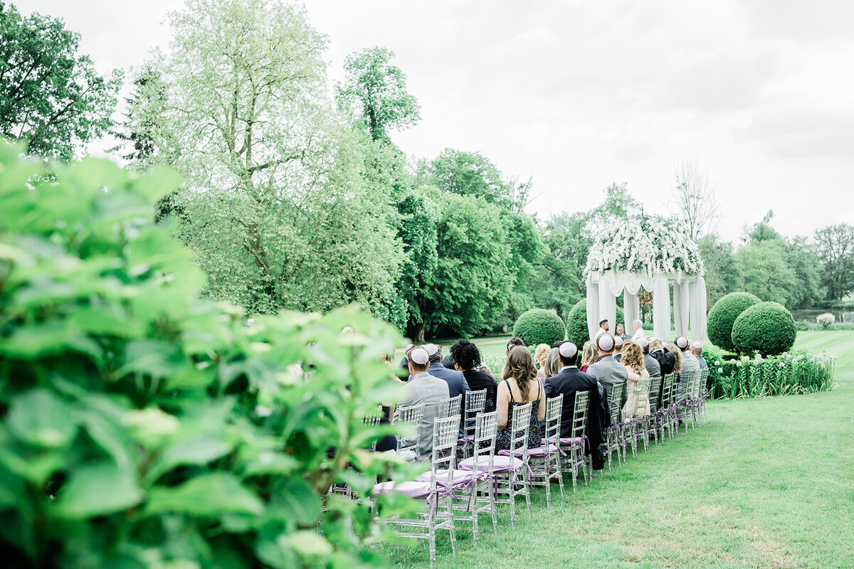 Beautifully arranged outdoor wedding ceremony at the gazebo of Château Challain, captured in elegant, romantic fine-art photography