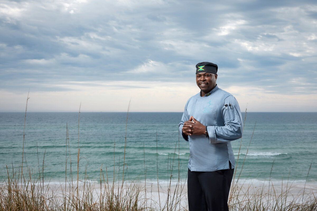 A chef standing at a beach