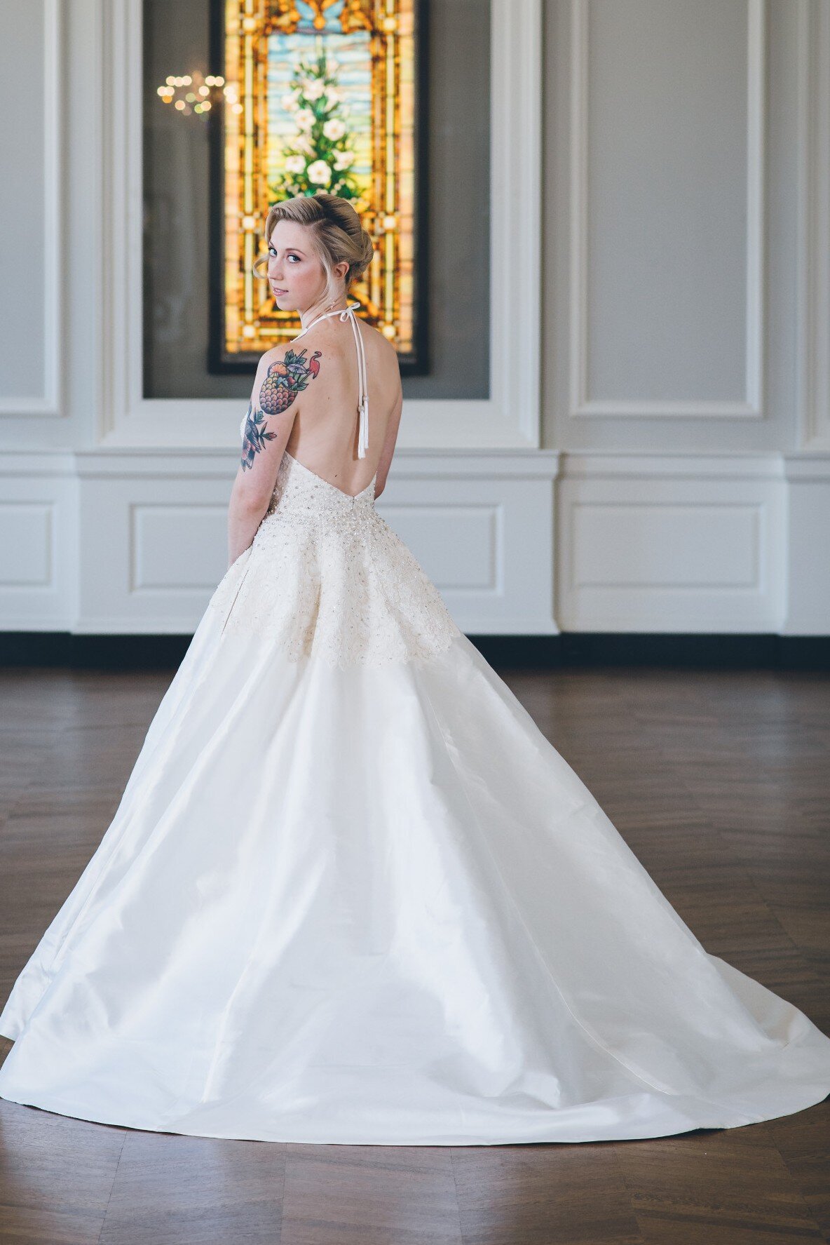 The full ballgown skirt and lace bodice make the Karli wedding dress style a modern and timeless bridal look.