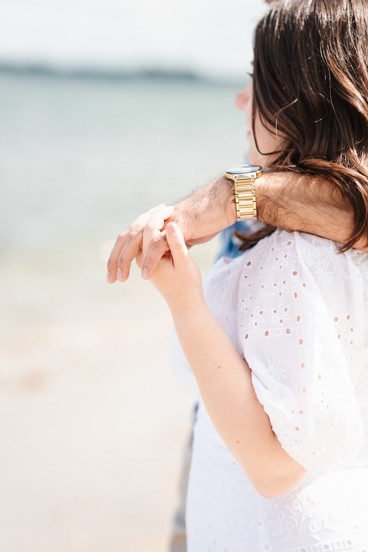 Coastal engagement session at Lynch Park in Beverly, Massachusetts with natural, candid moments.