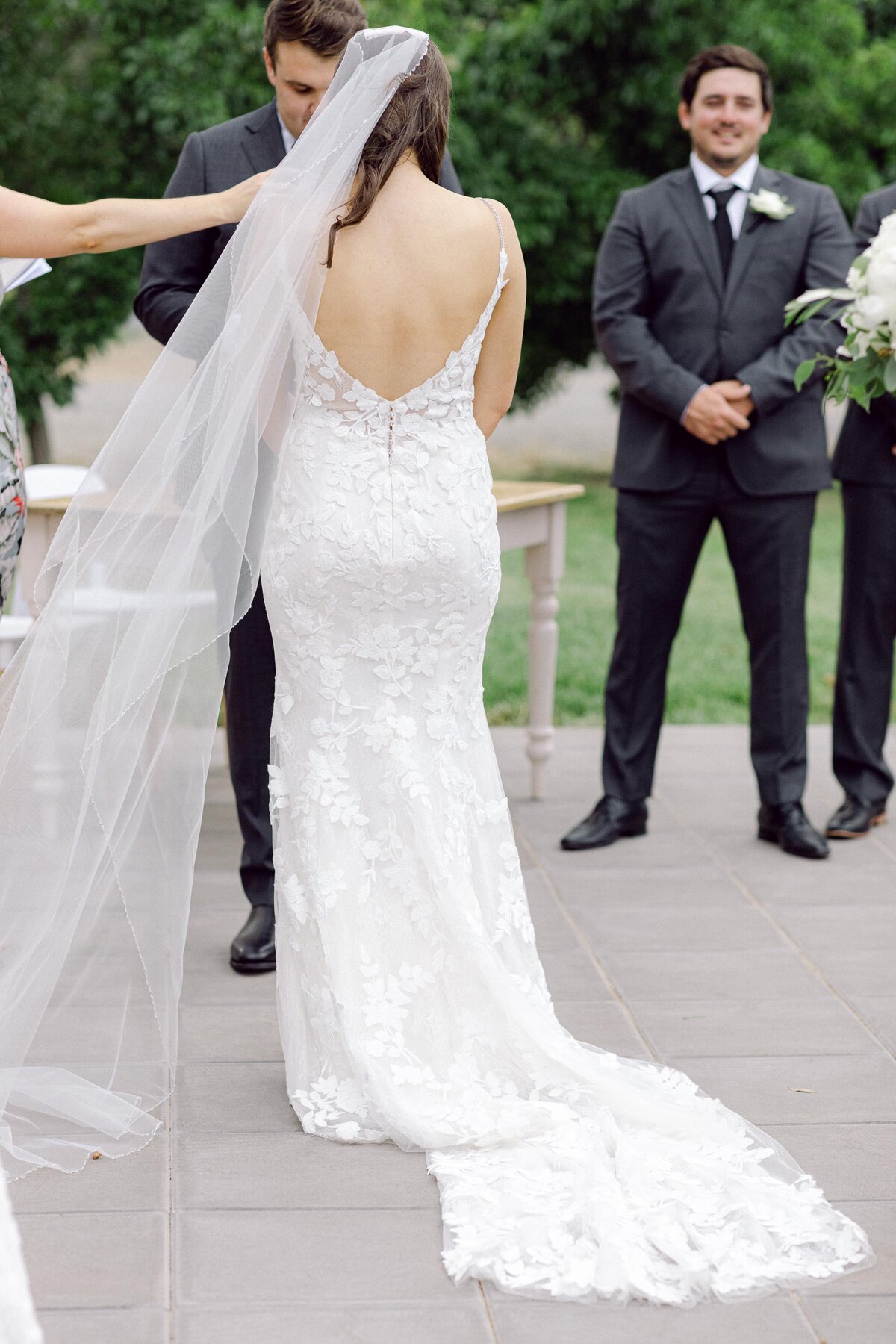 back view of brides gown and veil