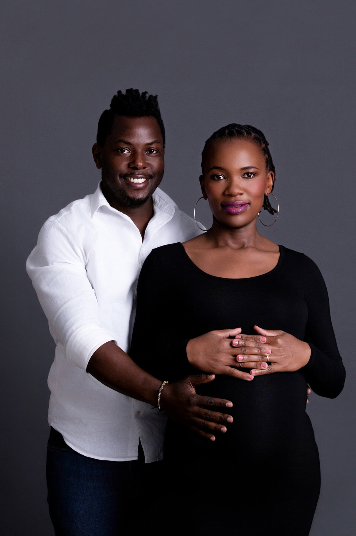 Pretoria maternity photographer – dramatic black gown studio portrait.