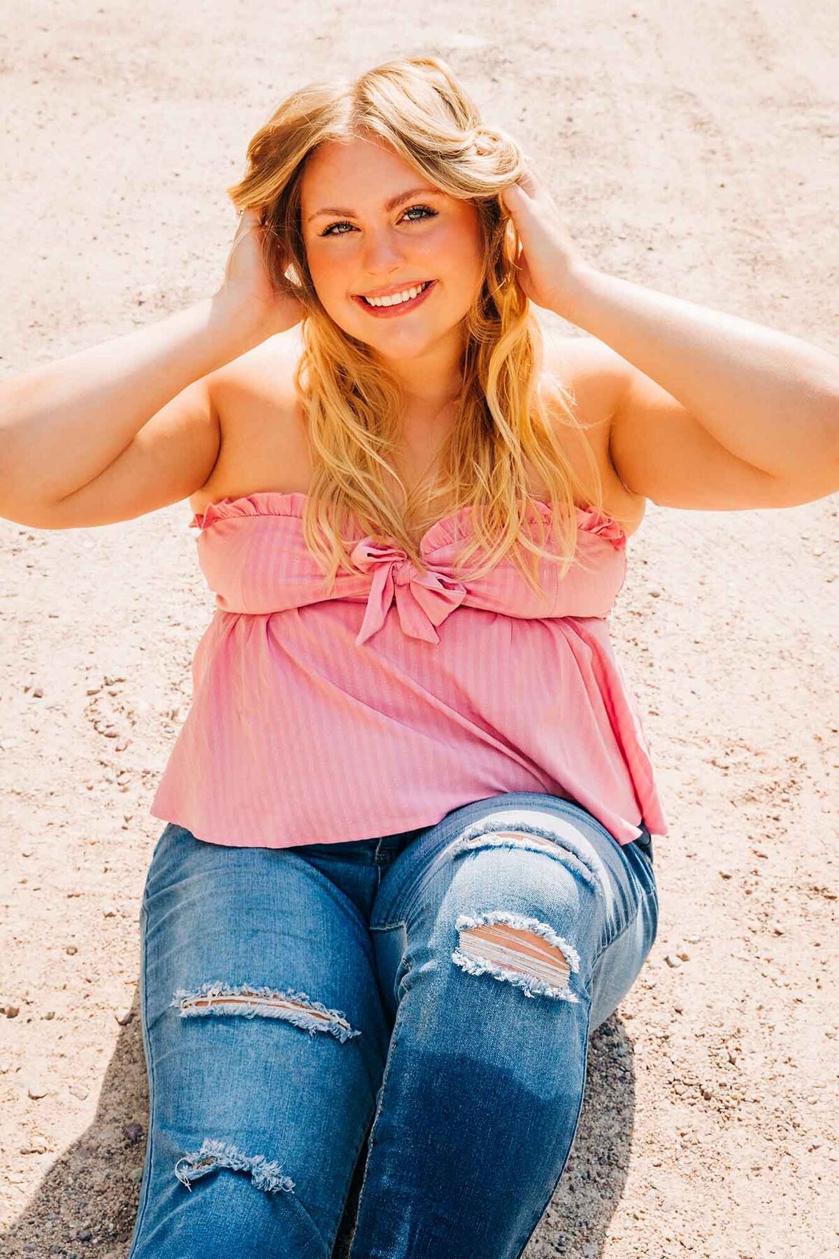 Female senior photo of girl in pink top