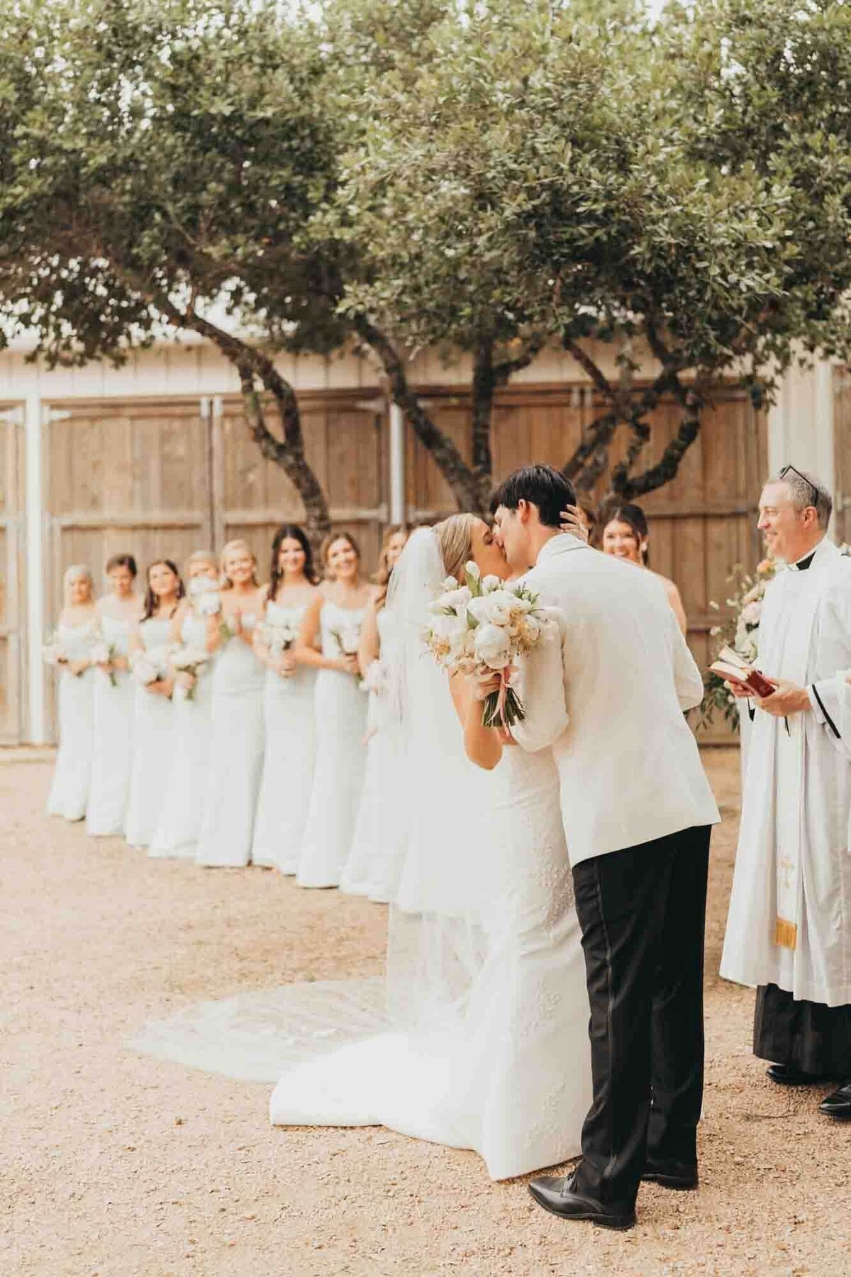 bride and groom share their first kiss of being married at the alter!