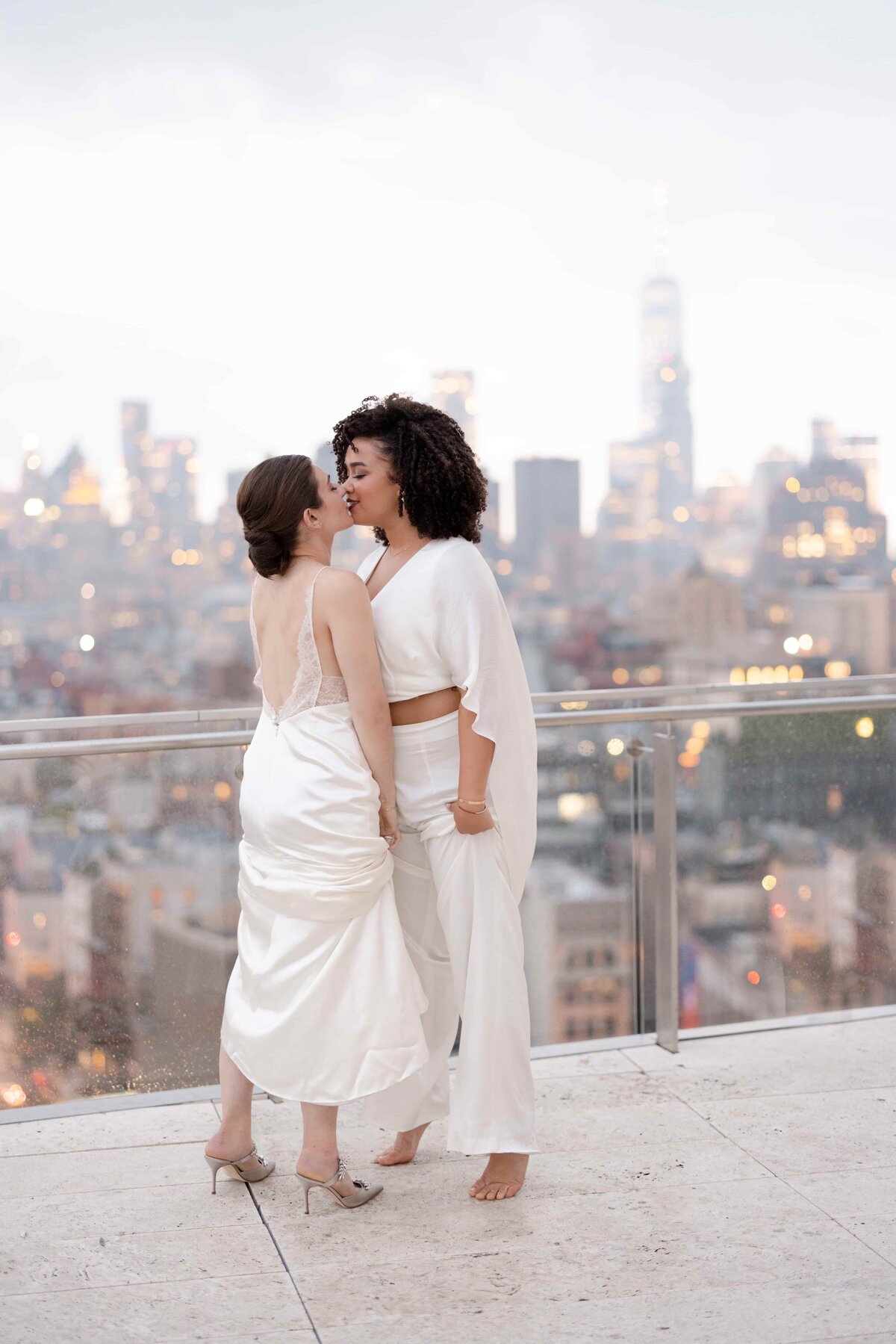 Two Brides Kissing