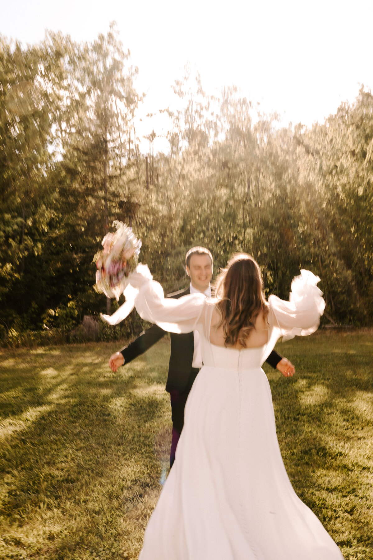 Bride and Grooms first look in a field at a June wedding at the Grand Ivory near Moncton, New Brunswick