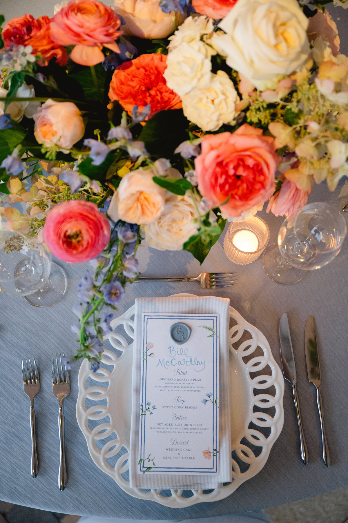 Close up of a flower arrangement and wedding announcement.