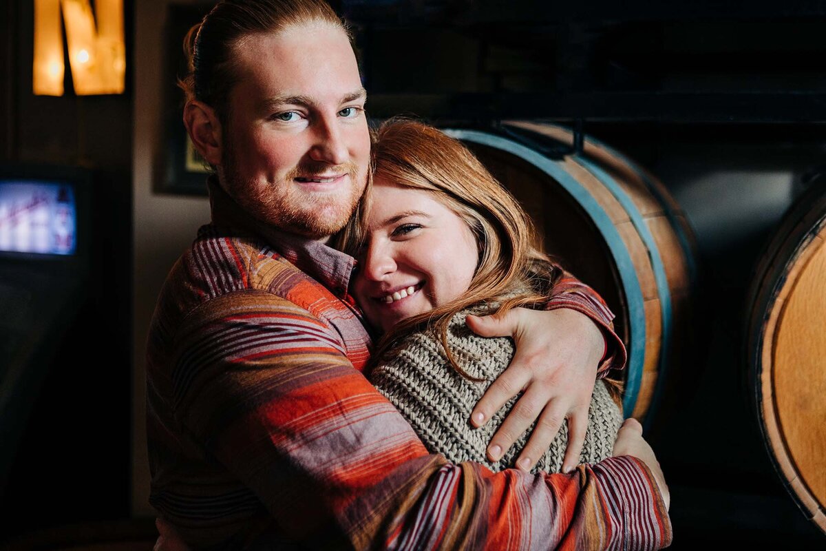 Missoula husband and wife hugging at Highlander Beer, Missoula