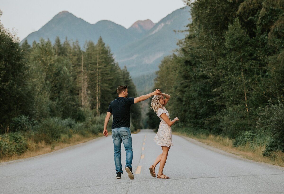 couple dancing in middle of the road