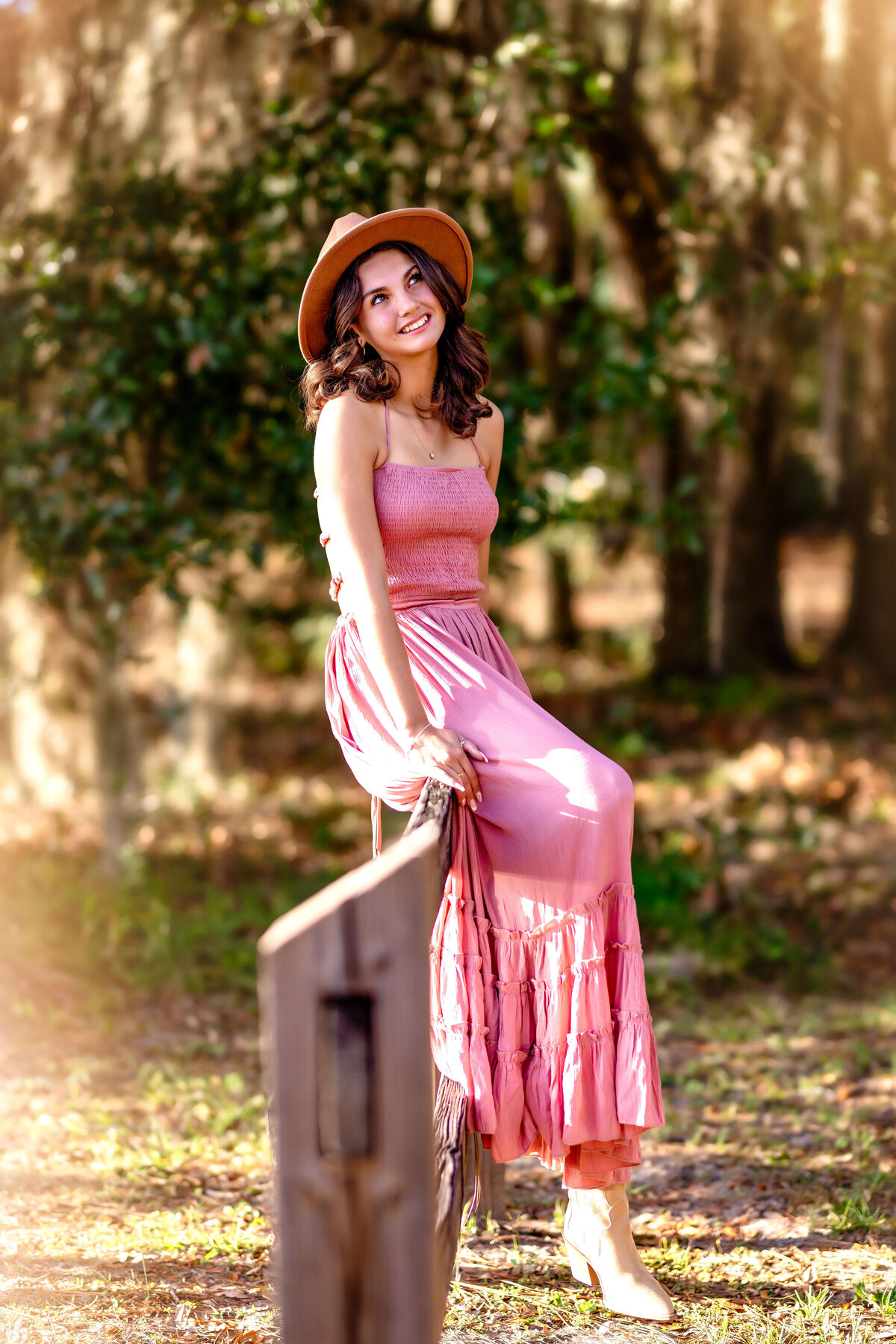 ink dress and soft expression during a fairytale-inspired senior portrait session in Winter Garden