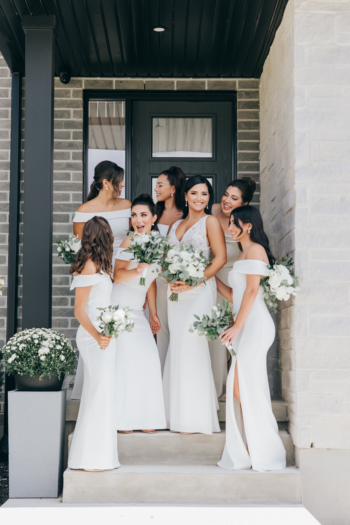 Bridesmaids in matching white dresses