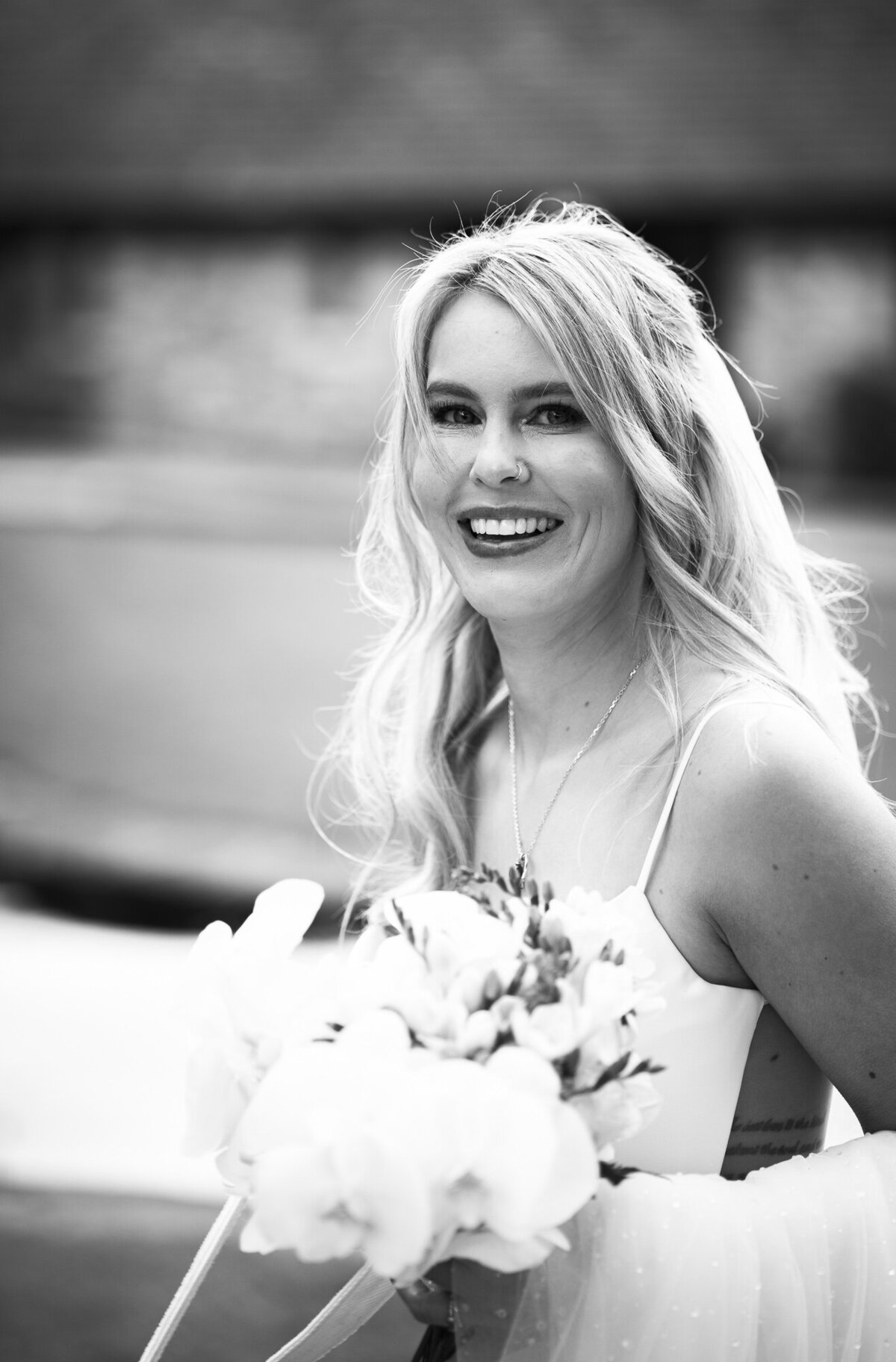 Beautiful black and white picture of bride outside at Mytton Fold Hotel taken by Anthony Horseman Wedding Photography and Film