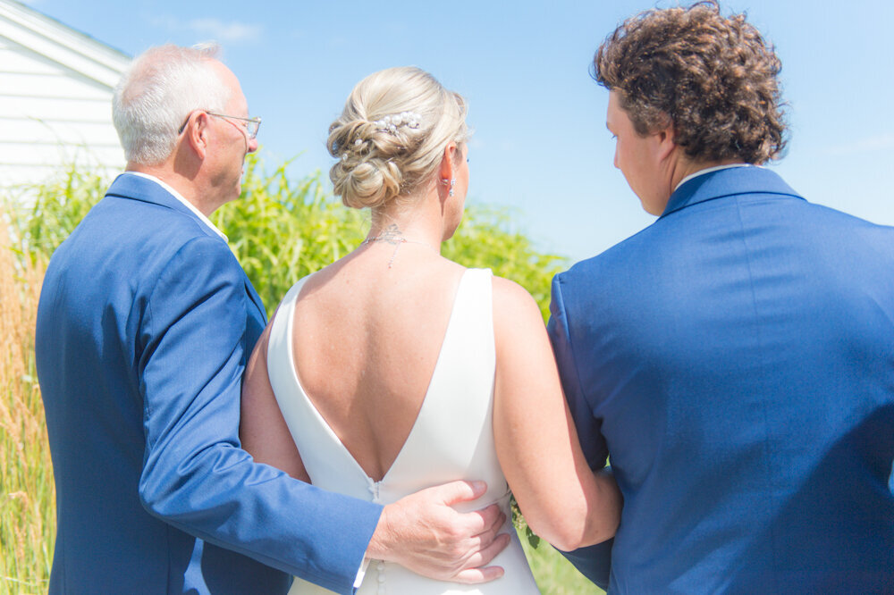 Son and Father walking bride down the isle at Union Bluff Meeting House Wedding York Beach Maine