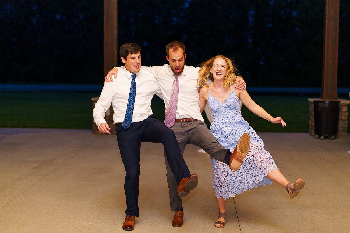 Guests do the can-can dance at a wedding at Four Seasons Barn in Cardington, Ohio.