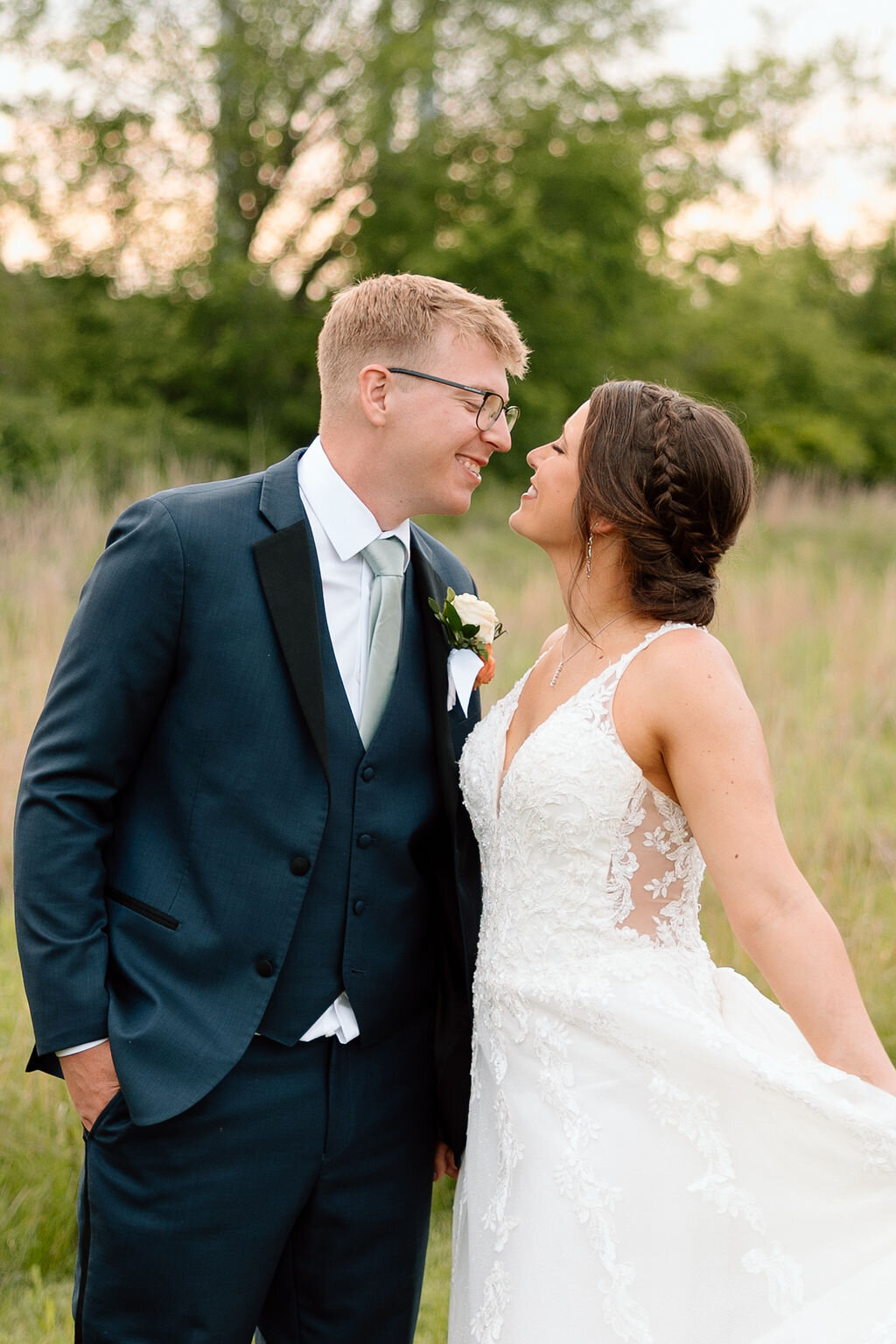 bride and groom embrace after wedding in kansas city
