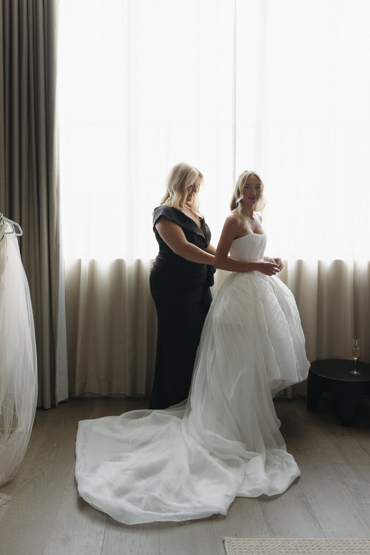 Fashion forward bridal preparation captured in editorial wedding photography style at NOBU Hotel Chicago, showcasing Lauren Alatriste's ability to create magazine-worthy imagery combining luxury aesthetics with authentic wedding emotion.