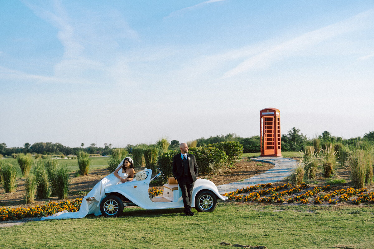 alt="Elegant wedding portrait with the vibrant Orlando city blue skies  in the background, Florida"