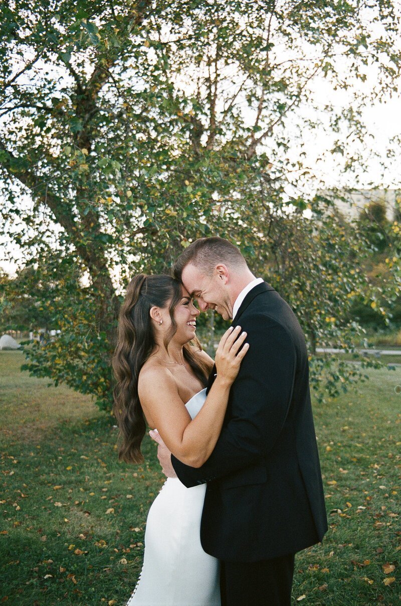 Bride and groom embracing, by film wedding photographer