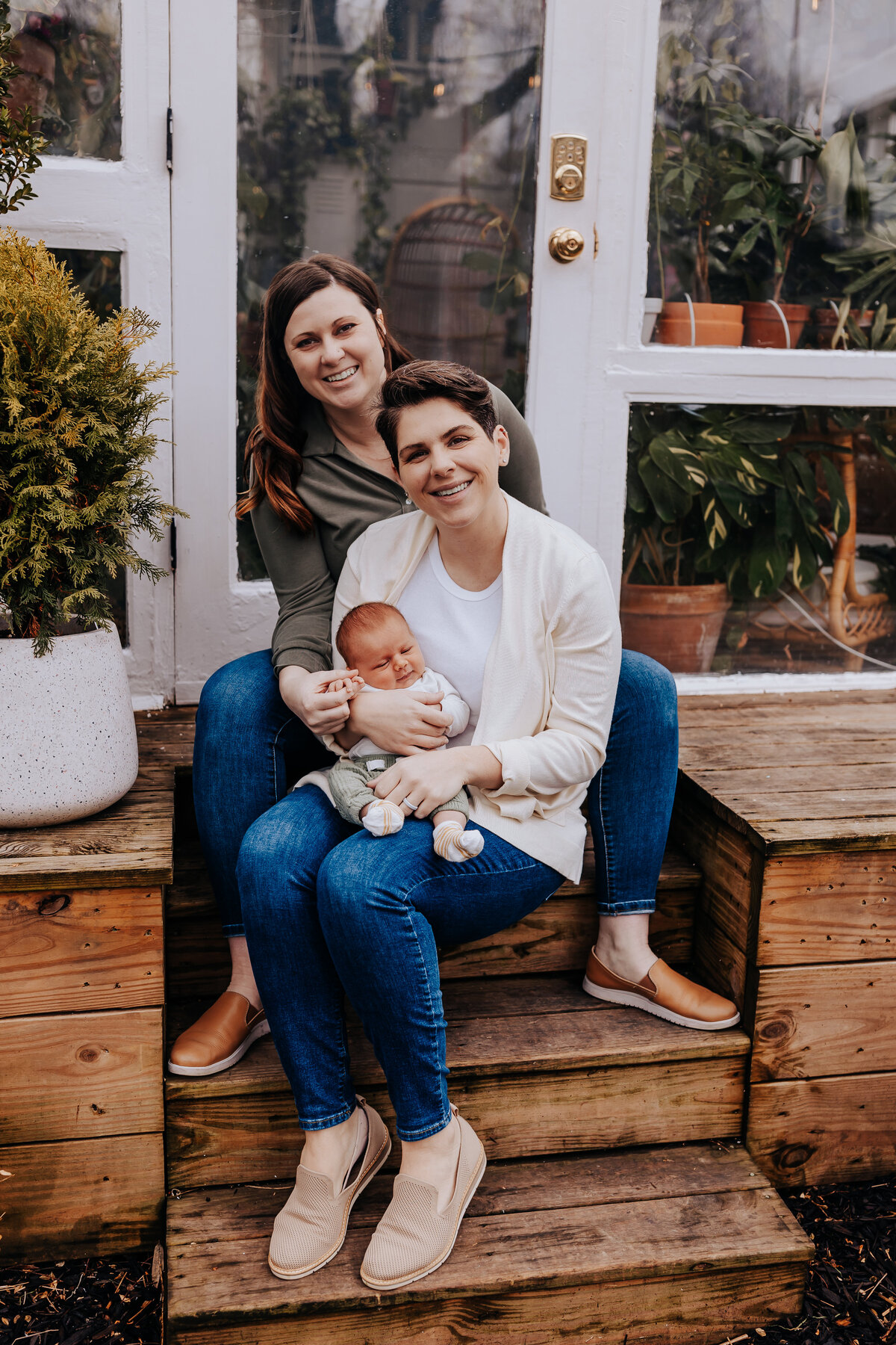 Nashville newborn photographer captures mother holding baby during outdoor newborn photos