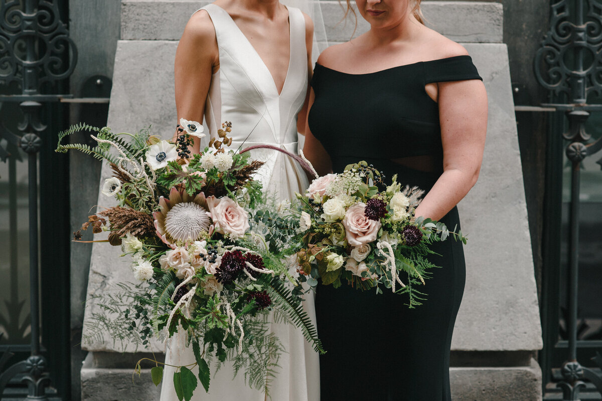 A bride holds an organic cascading  bouquet at a Montreal wedding.