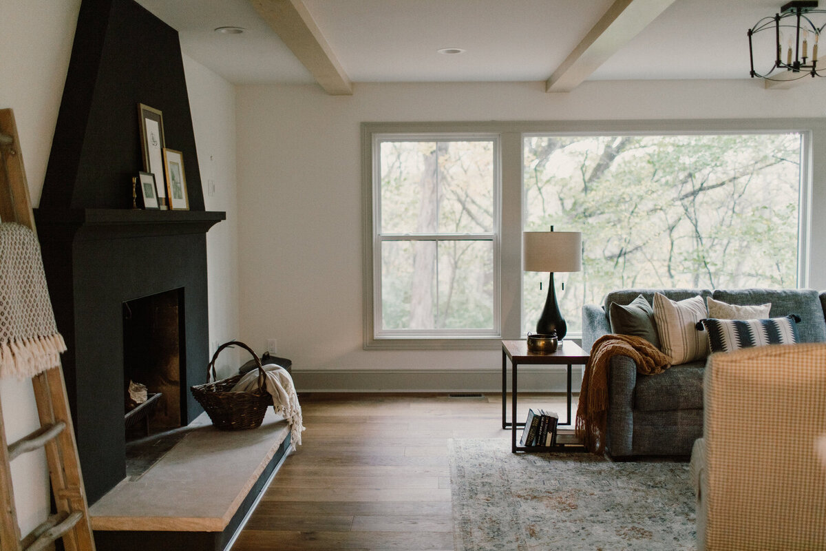 Prestige Builders  transitional living room remodel in Ames Iowa and home addition with black contrasting accents 