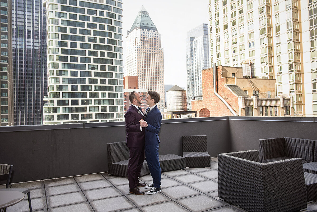 A couple dancing on a rooftop
