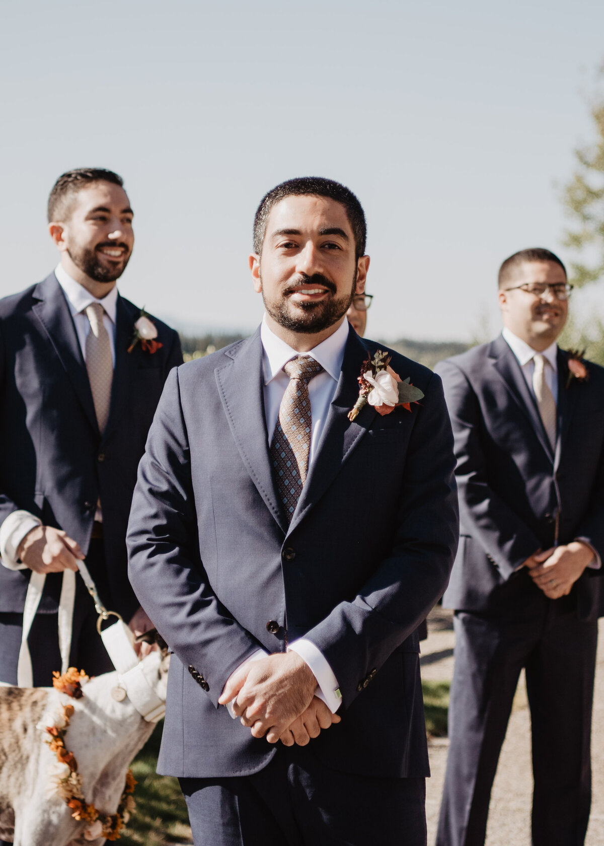 Photographers Jackson Hole capture groom smiling at alter