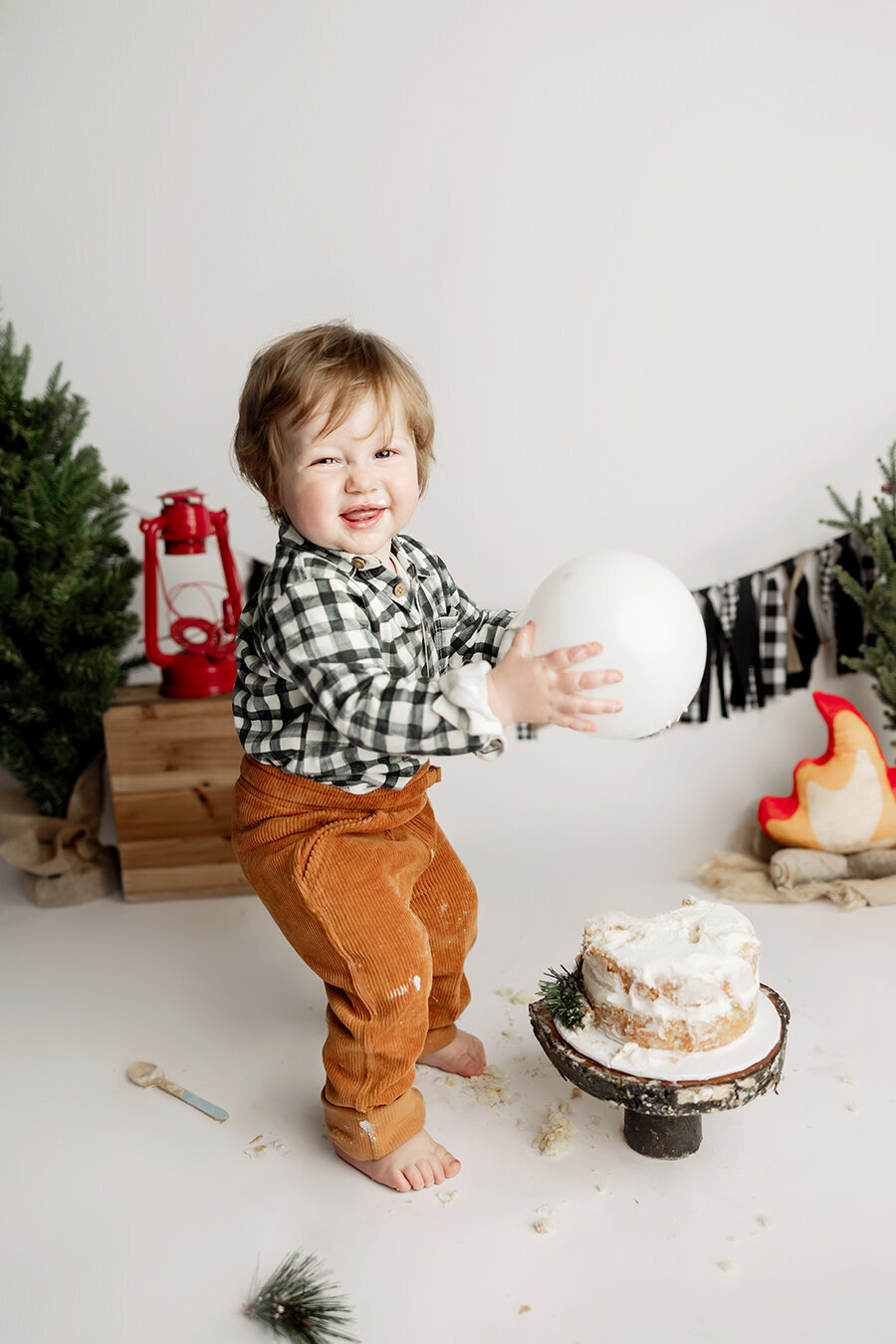 Outdoor theme cake smash session in Colorado with adorable one year old boy