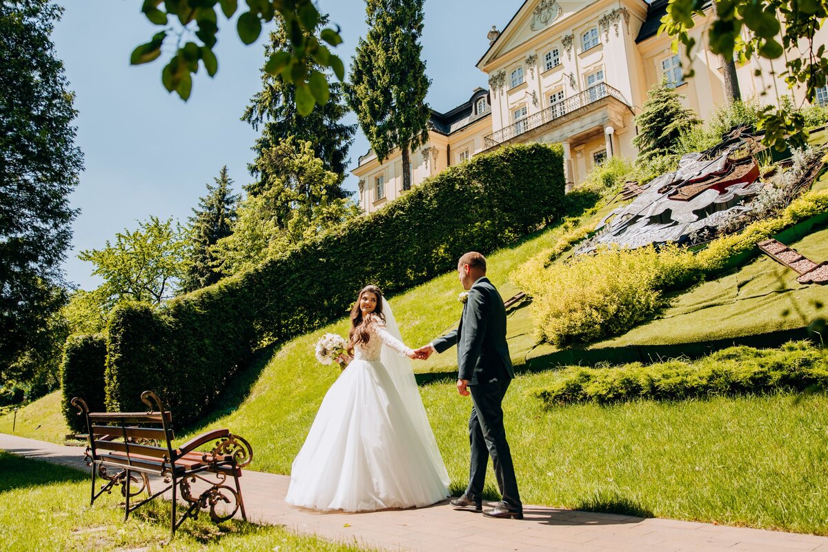 Bride and groom outdoors at their destination summer wedding.