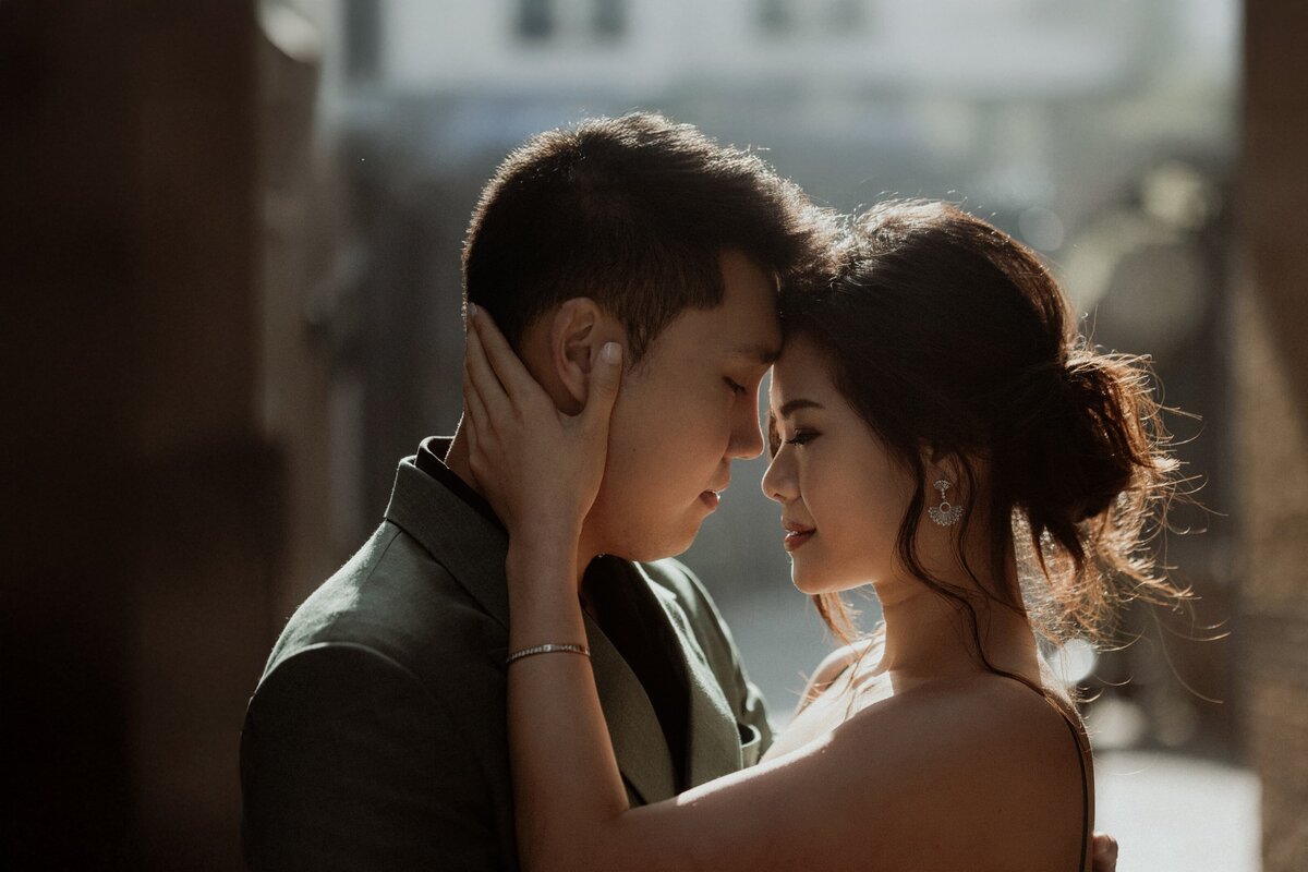 A candid moment shared between a romantic couple during London elopement photography