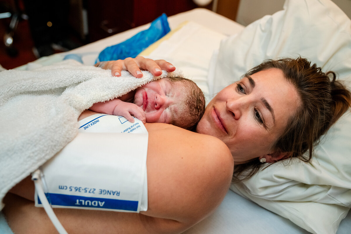 mother-embracing-new-baby