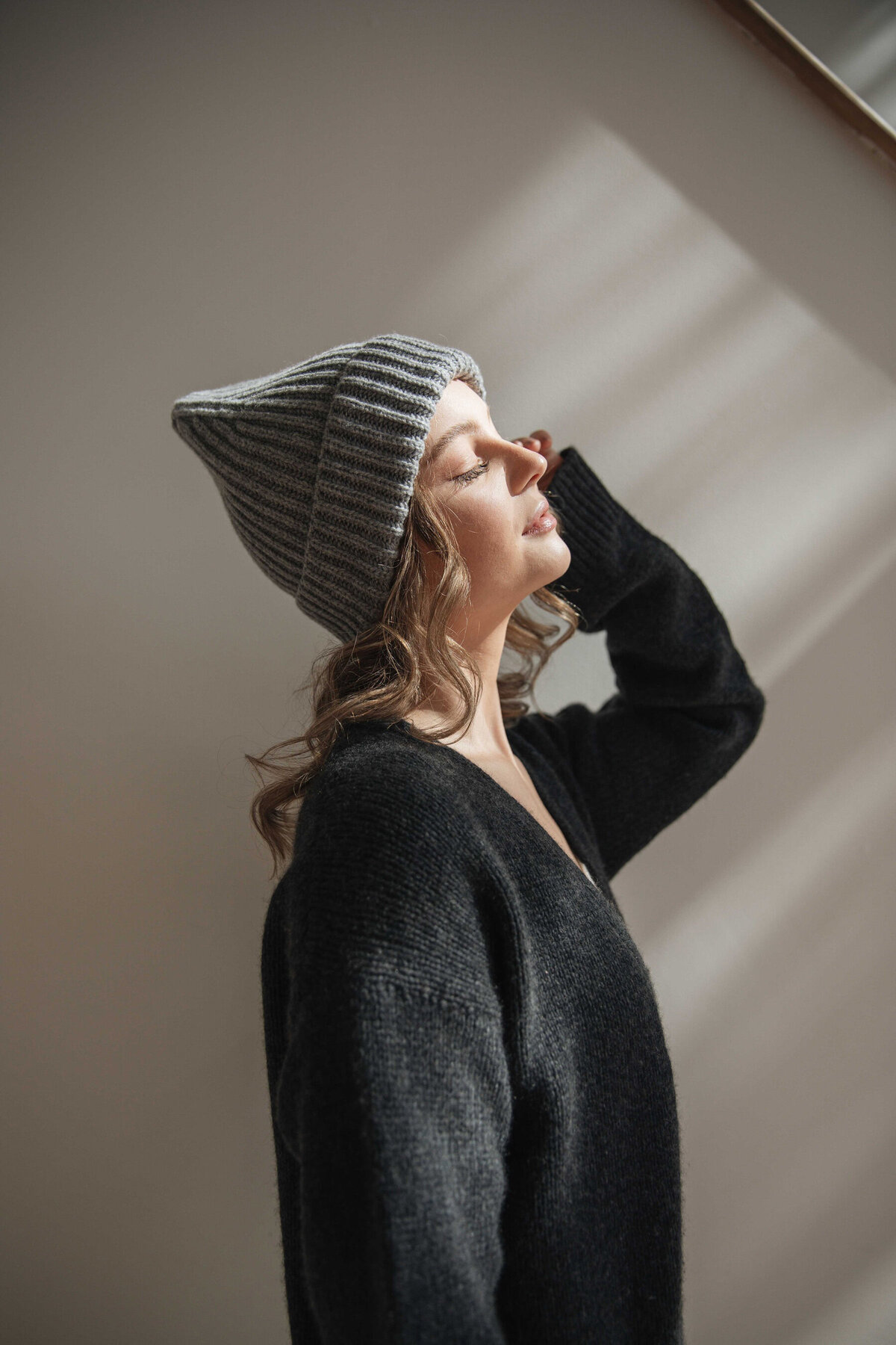 Image of girl in cashmere cardigan and hat