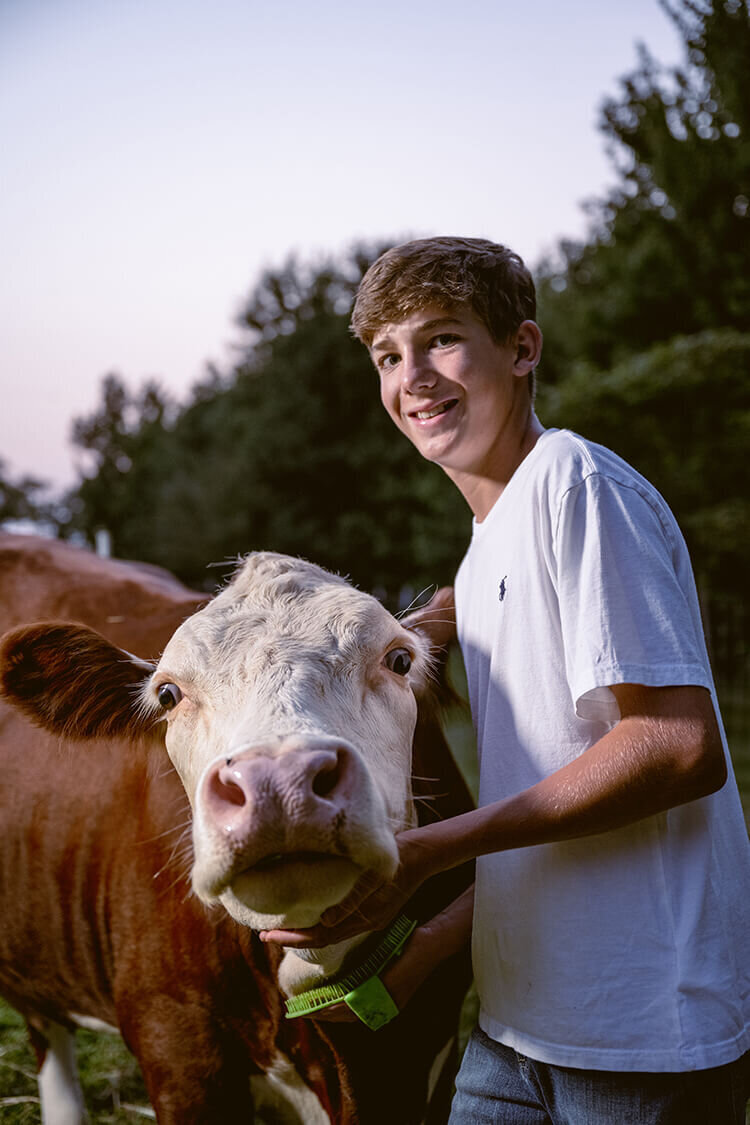 homestead-boy-with-farm-cow