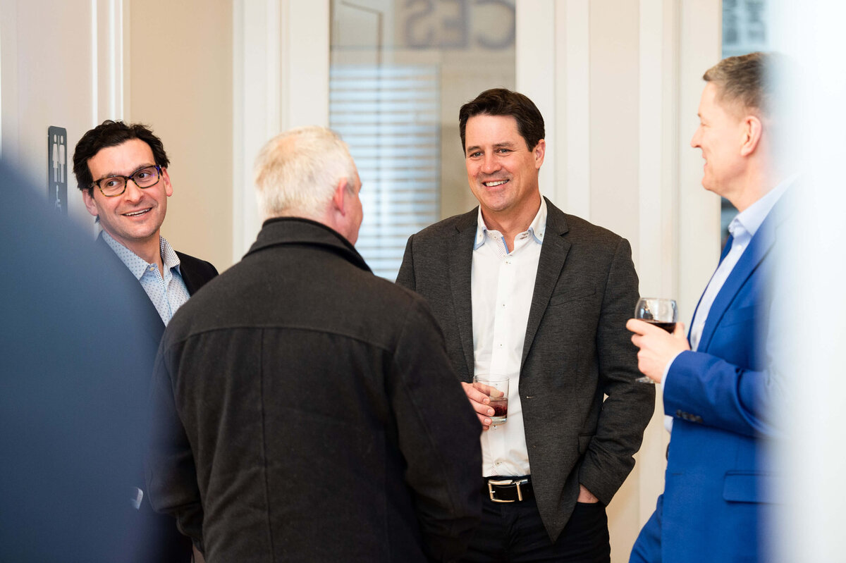 the eQ team mingling and chatting with guests during the Groundbreaking event.  the host of eQ addressing and welcoming guests to the eQ Groundbreaking event.  Captured by Ottawa Event Photographer JEMMAN Photography COMMERCIAL